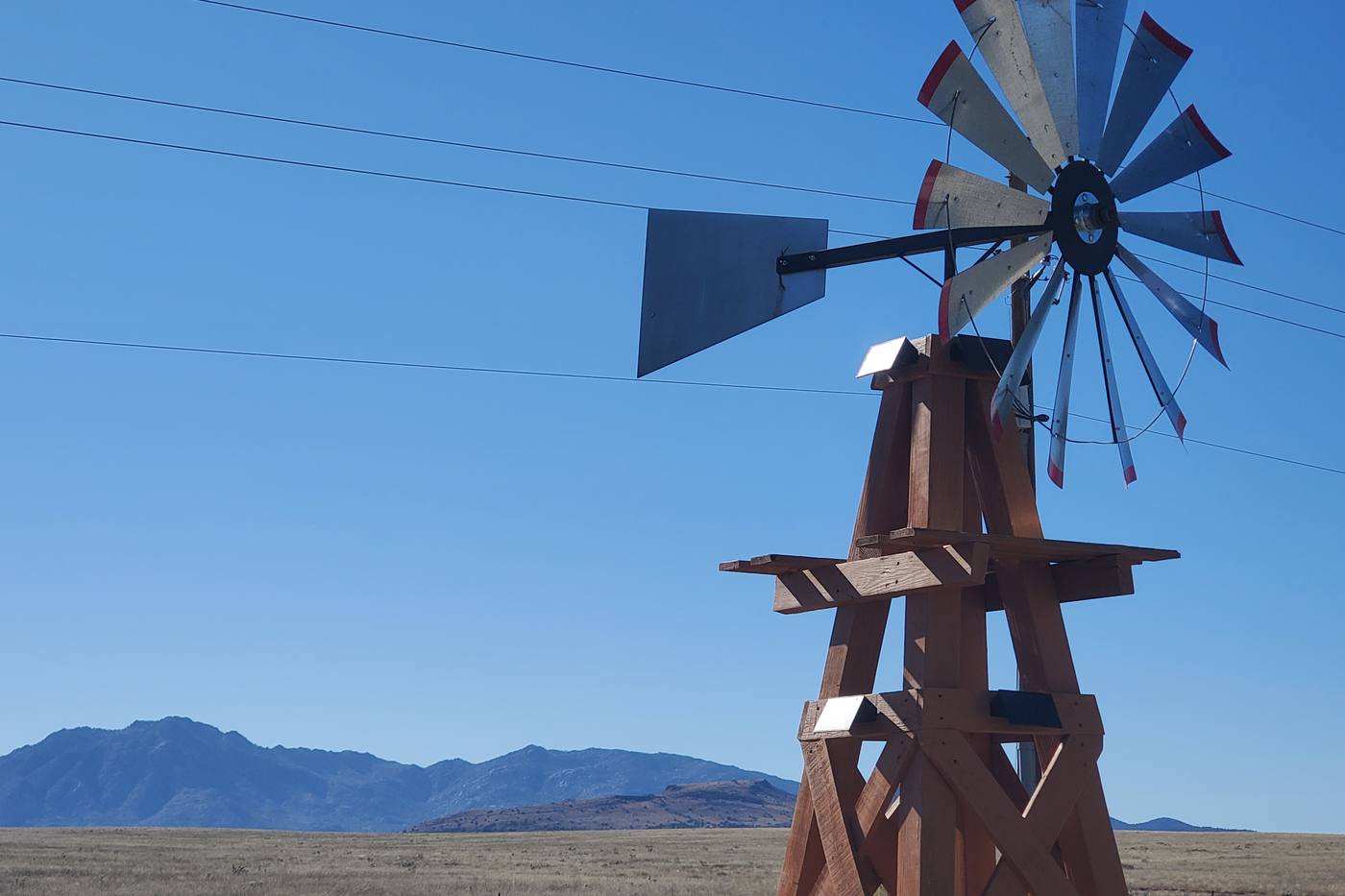 The windmill under a wide Arizona sky